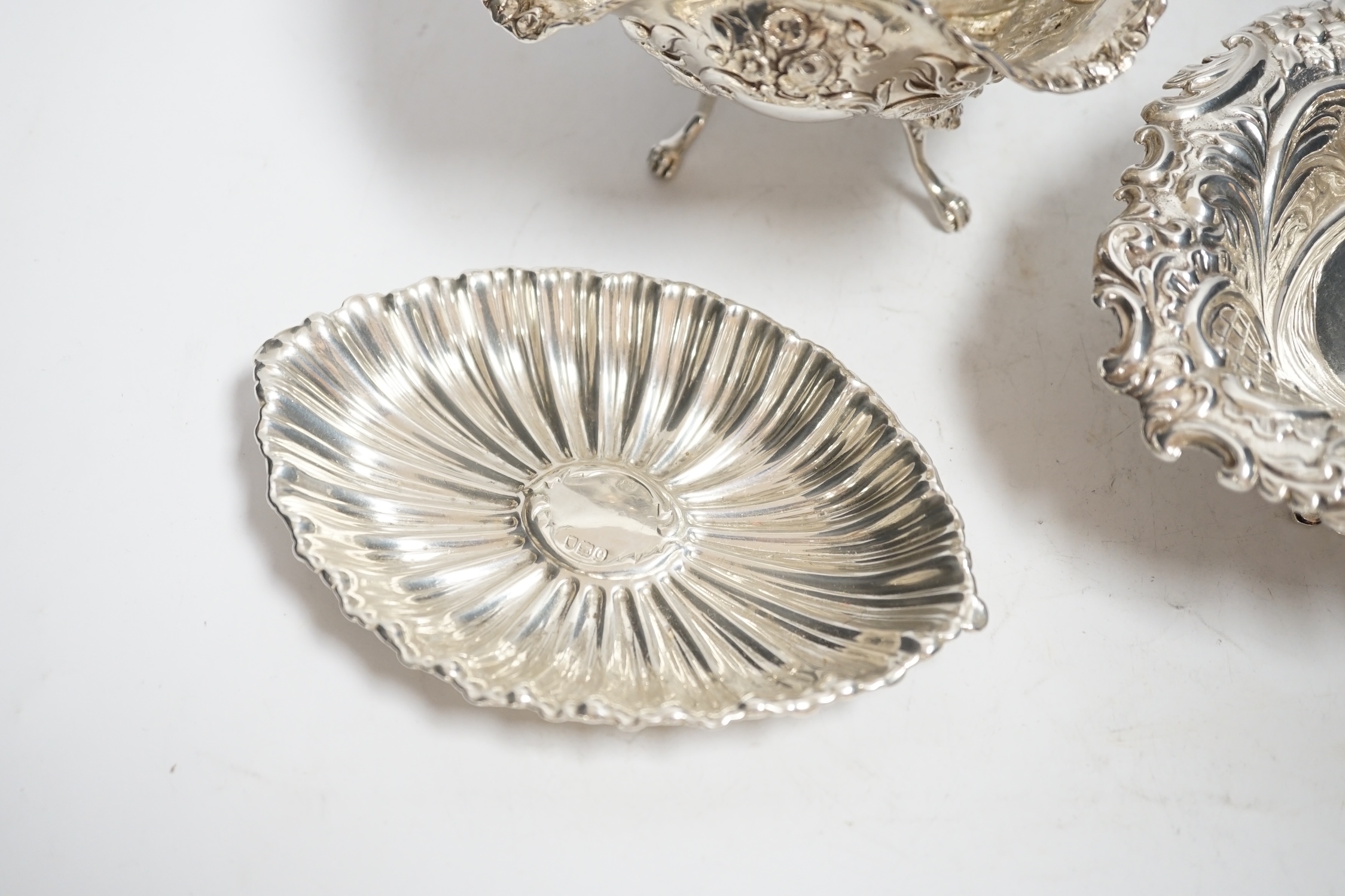 A late Victorian repousse silver heart shaped dish, I.S. Greenburg & Co, Birmingham, 1894, 14.3cm, a small silver dish and Hanau white metal bowl, 12.1oz.